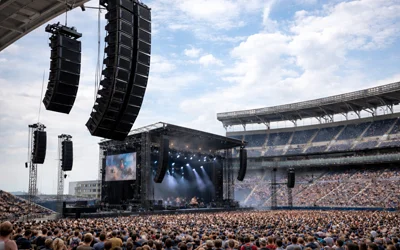 Distributed audio speaker arrays installed for a large outdoor concert venue