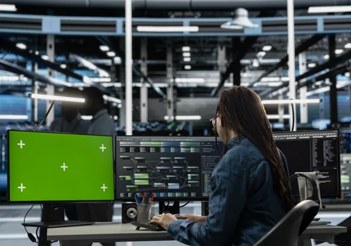 Engineer operating networked AV and control systems within a professional integration environment.