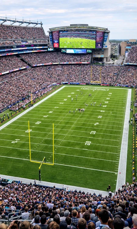 Wide view of sports stadium with integrated AV systems and crowd