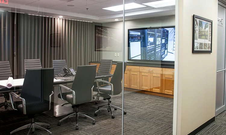 corporate conference room with multiple video displays and audio systems