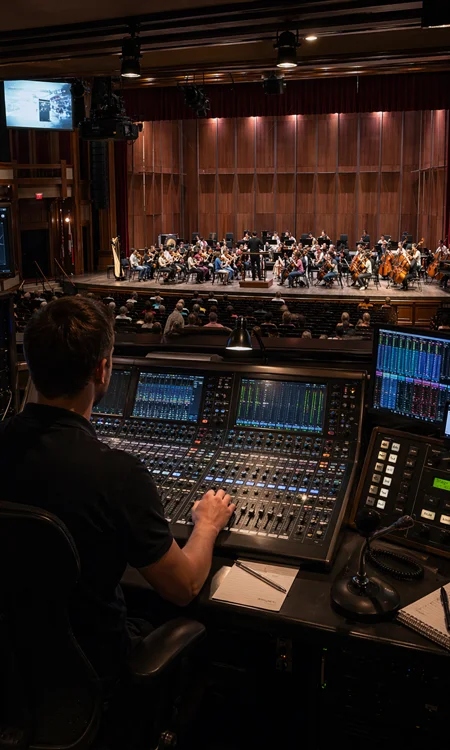 Theater Control Booth Integration Theater control booth with audio console and communication systems
