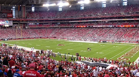 Modern stadium interior with LED video boards and integrated AV systems during live event