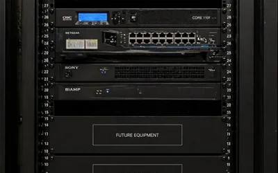 AV equipment rack with reserved space for future expansion