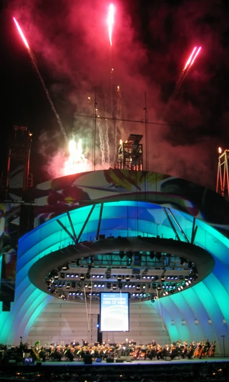 Hollywood Bowl venue context image Seating-bowl perspective inside a large outdoor amphitheater with the stage visible in the distance
