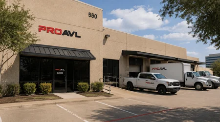 Pro AVL Dallas Office exterior with branded work vehicles outside a commercial facility