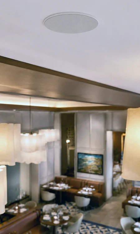 Luxury Hotel Restaurant Recessed Ceiling Speaker Recessed ceiling speaker in a luxury hotel restaurant supporting discreet hospitality AV integration by Pro AVL